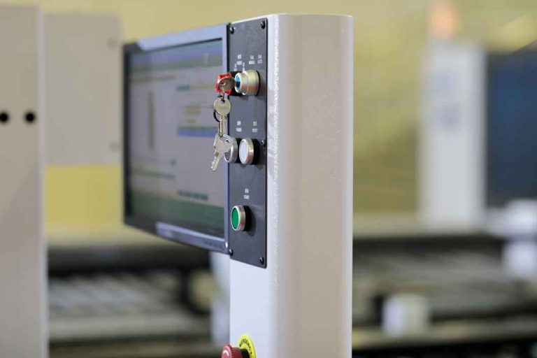 PLC & HMI based control panel with touch screen for automatic manufacturing line. Selective focus.