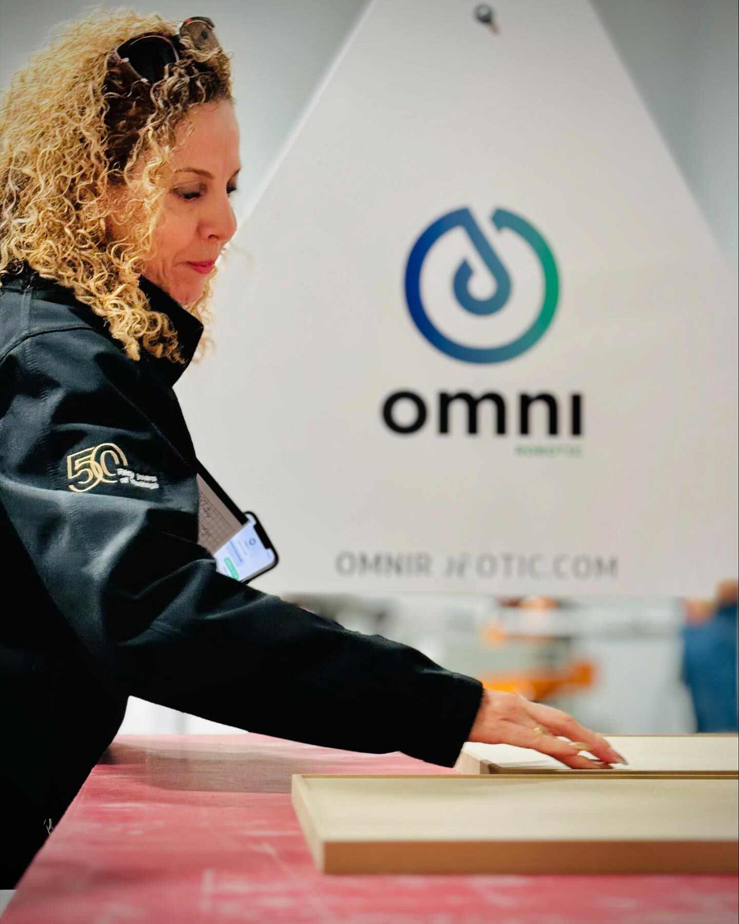 A customer closely inspects the superior sanding quality delivered by the PSA-80 PRO at Woodworking Technology Days, Akhurst, Toronto, October 2024.