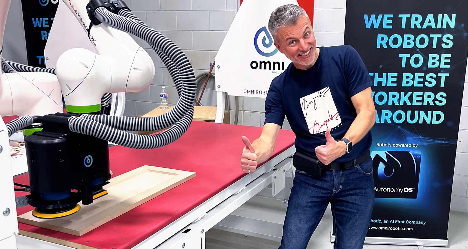 François Simard, happy and smiling, poses next to the PSA-80 PRO at Woodworking Technology Days, Akhurst, Toronto, October 2024.