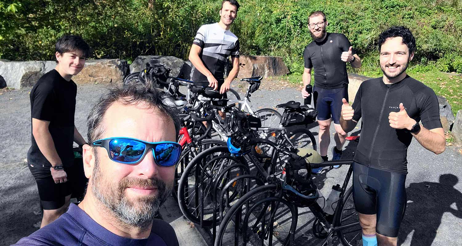 Smiles all around as the team prepares for an exciting cycling adventure.