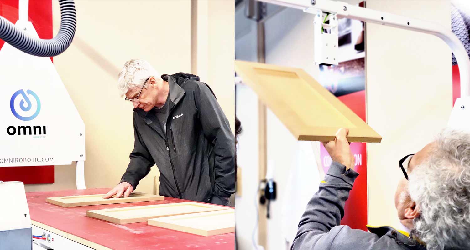 Close-up of customers carefully inspecting the sanding quality on a door panel after the PSA-80 Pro demonstration at the Focus Show in Delta, BC, April, 2024.