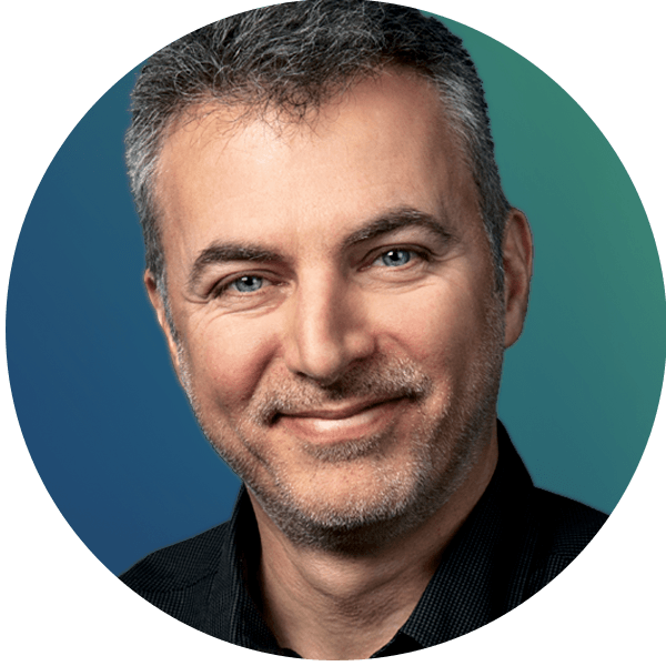 Smiling man with short gray hair in a black shirt, circular photo with blue-to-teal gradient background.
