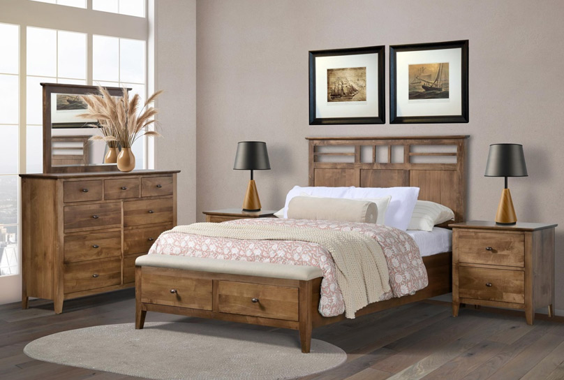 Cozy wooden bedroom with a bed, matching nightstands, dresser with mirror, and a bench at the foot of the bed under two framed pictures.